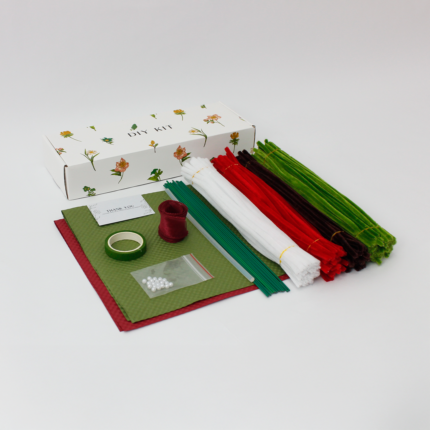 Midnight Evergreen DIY flower bouquet kit with red tulips, pinecones, white berries, candy cane, and a mini Christmas tree made from pipe cleaners. Ideal for holiday gifts or Christmas crafting fun.