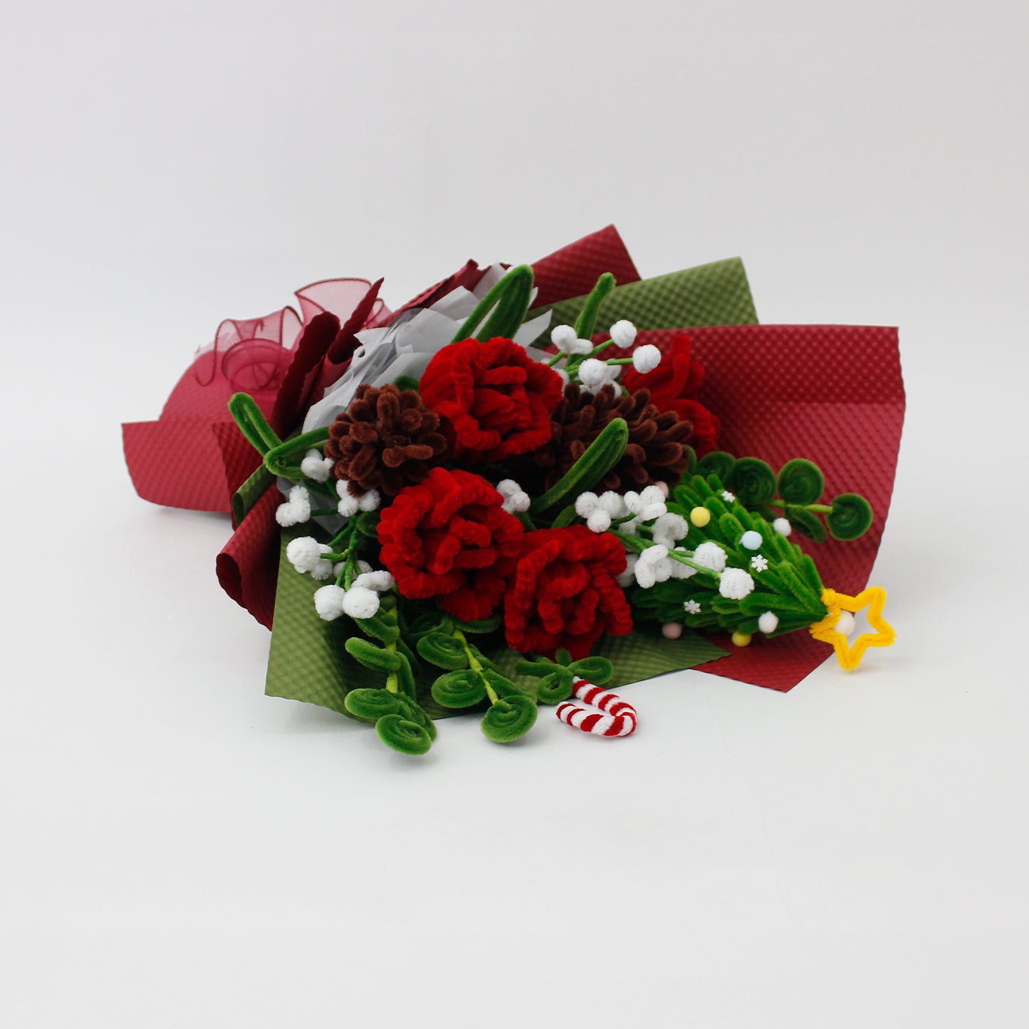 Midnight Evergreen DIY flower bouquet kit with red tulips, pinecones, white berries, candy cane, and a mini Christmas tree made from pipe cleaners. Ideal for holiday gifts or Christmas crafting fun.