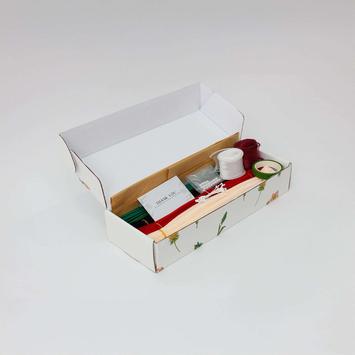 DIY flower bouquet kit "Winter Whispers" featuring handmade pinecones, red lily, candy cane, tulips, and cotton flowers made from pipe cleaners. Perfect for Christmas crafting or gifting.