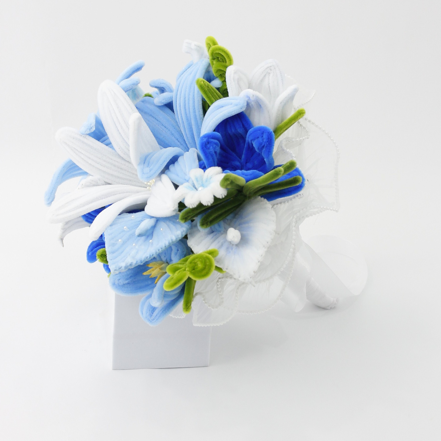 Bride holding a handmade everlasting wedding bouquet in blue and white tones, crafted from pipe cleaners, unique bridal flower arrangement in Australia.