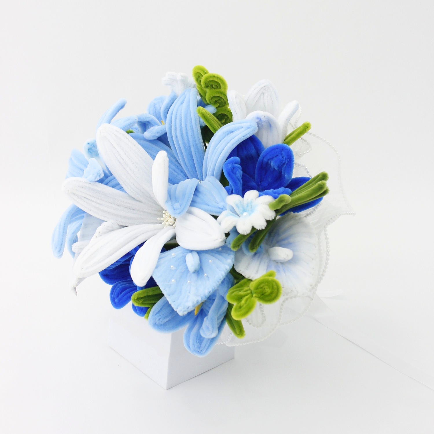 Bride holding a handmade everlasting wedding bouquet in blue and white tones, crafted from pipe cleaners, unique bridal flower arrangement in Australia.