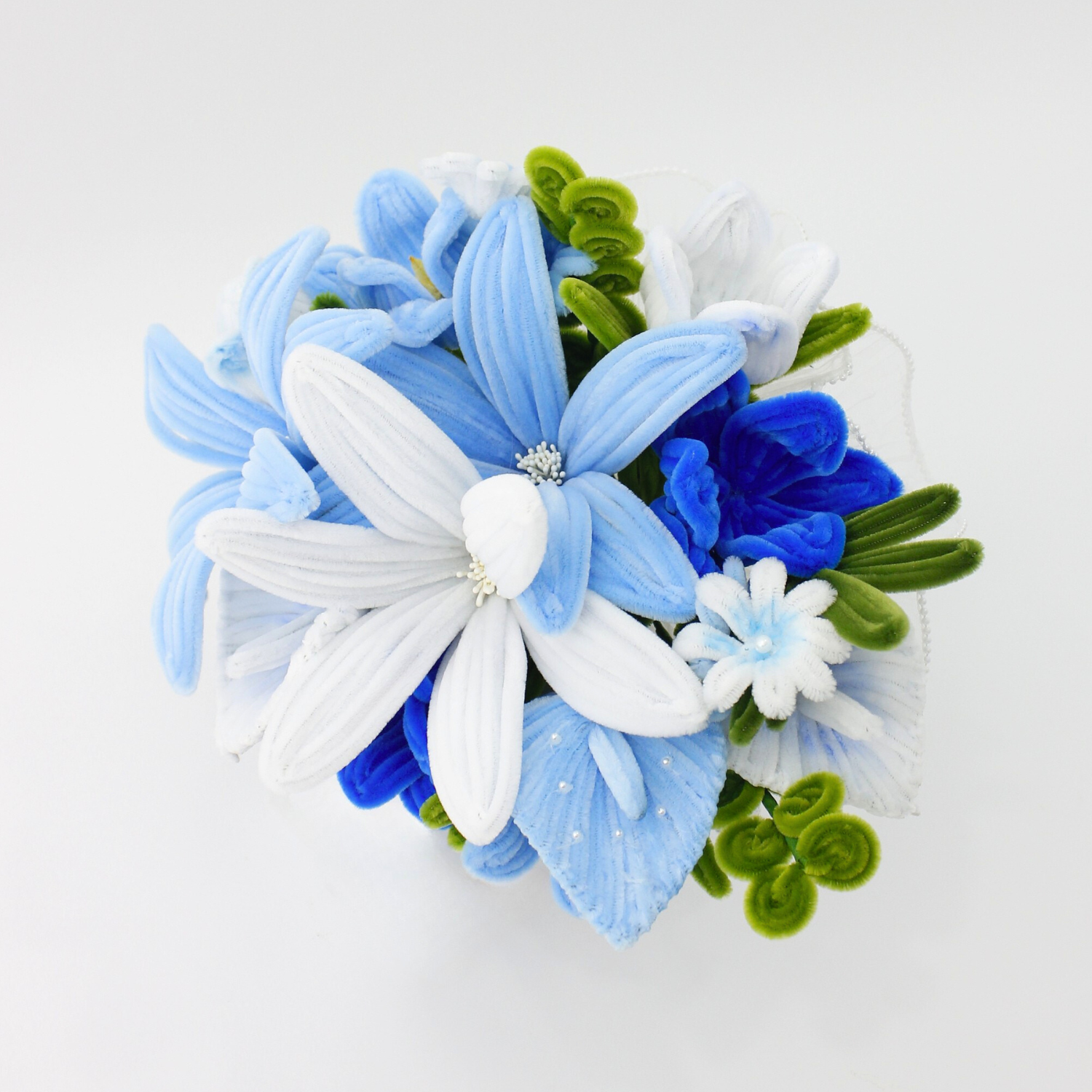 Bride holding a handmade everlasting wedding bouquet in blue and white tones, crafted from pipe cleaners, unique bridal flower arrangement in Australia.