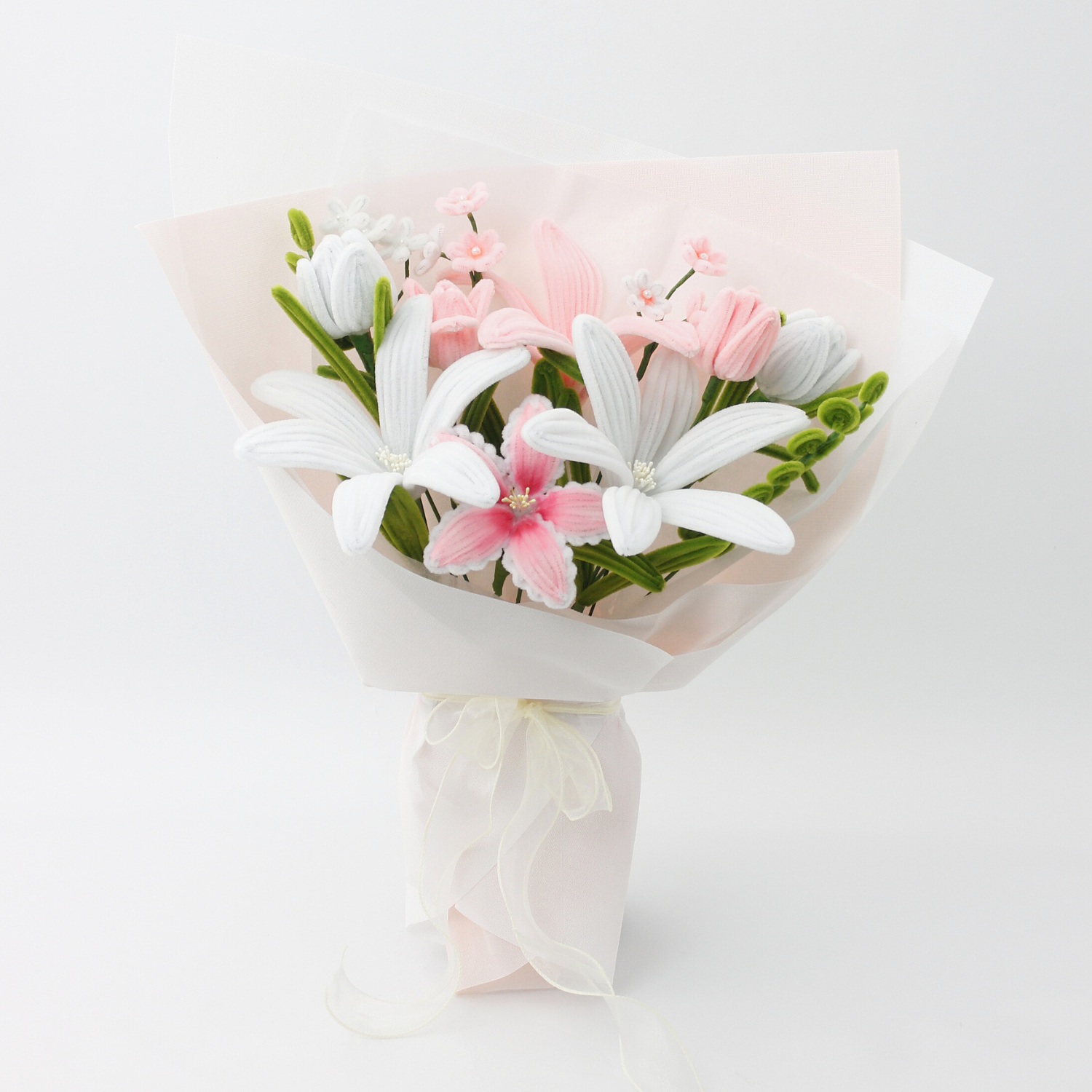 Handmade everlasting bouquet with white and pastel pink lilies, crafted from pipe cleaners, elegant finished flower arrangement gift in Australia for weddings, birthdays, and anniversaries.