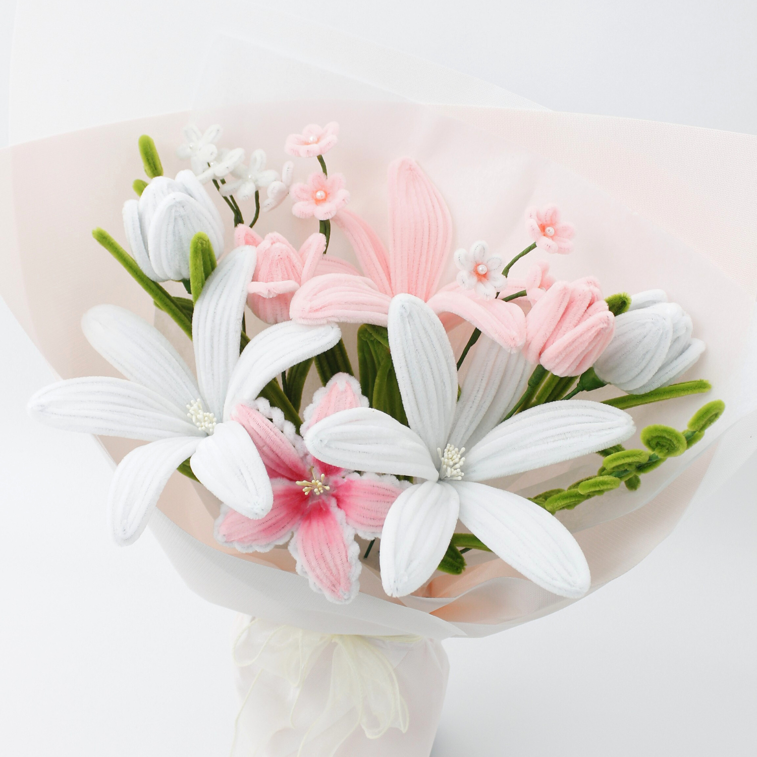 Handmade everlasting bouquet with white and pastel pink lilies, crafted from pipe cleaners, elegant finished flower arrangement gift in Australia for weddings, birthdays, and anniversaries.