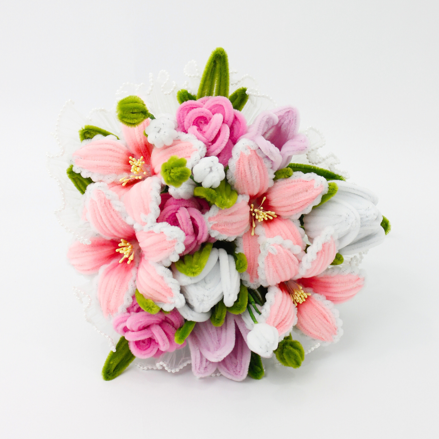 Bride holding a handmade everlasting wedding bouquet in pink and lilac tones with lilies and roses, crafted from pipe cleaners, romantic bridal flower arrangement in Australia.