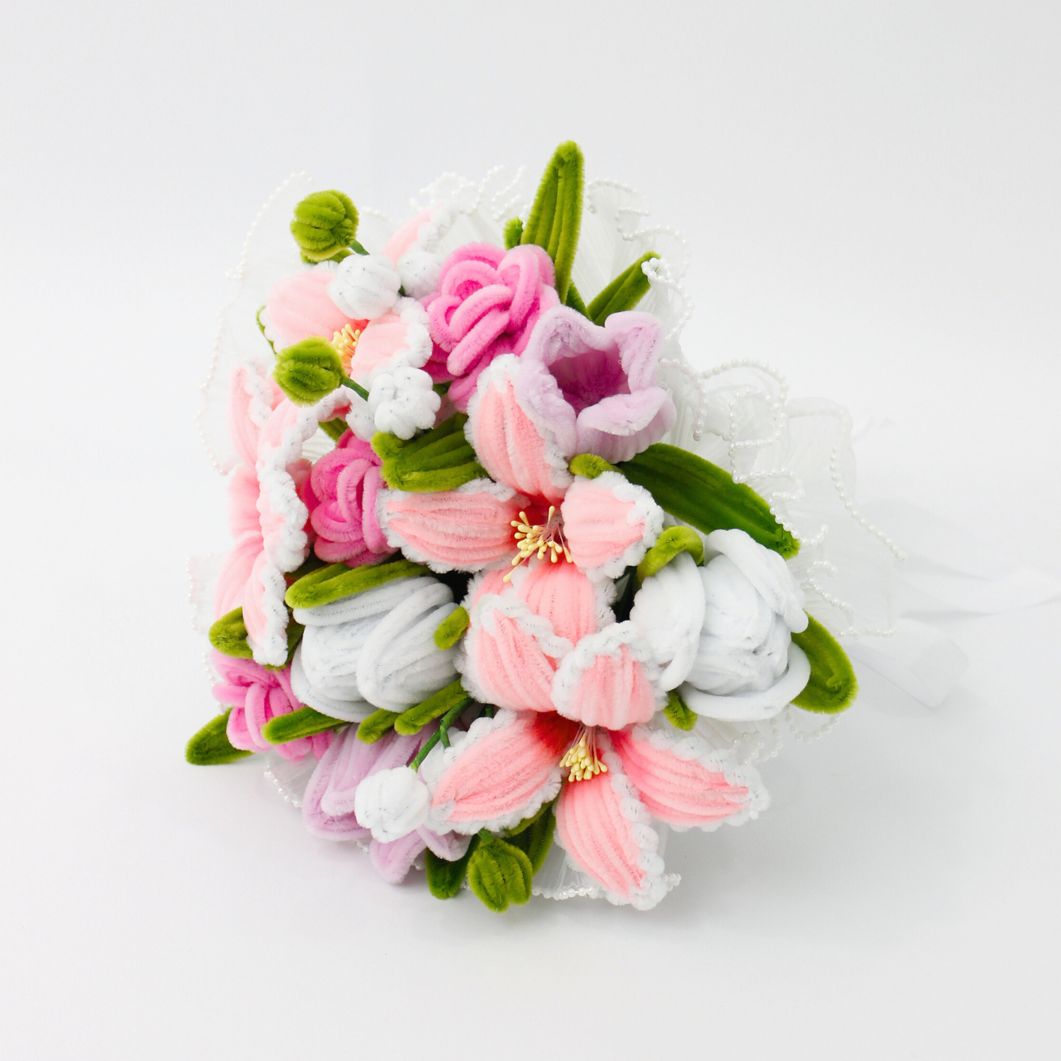 Bride holding a handmade everlasting wedding bouquet in pink and lilac tones with lilies and roses, crafted from pipe cleaners, romantic bridal flower arrangement in Australia.