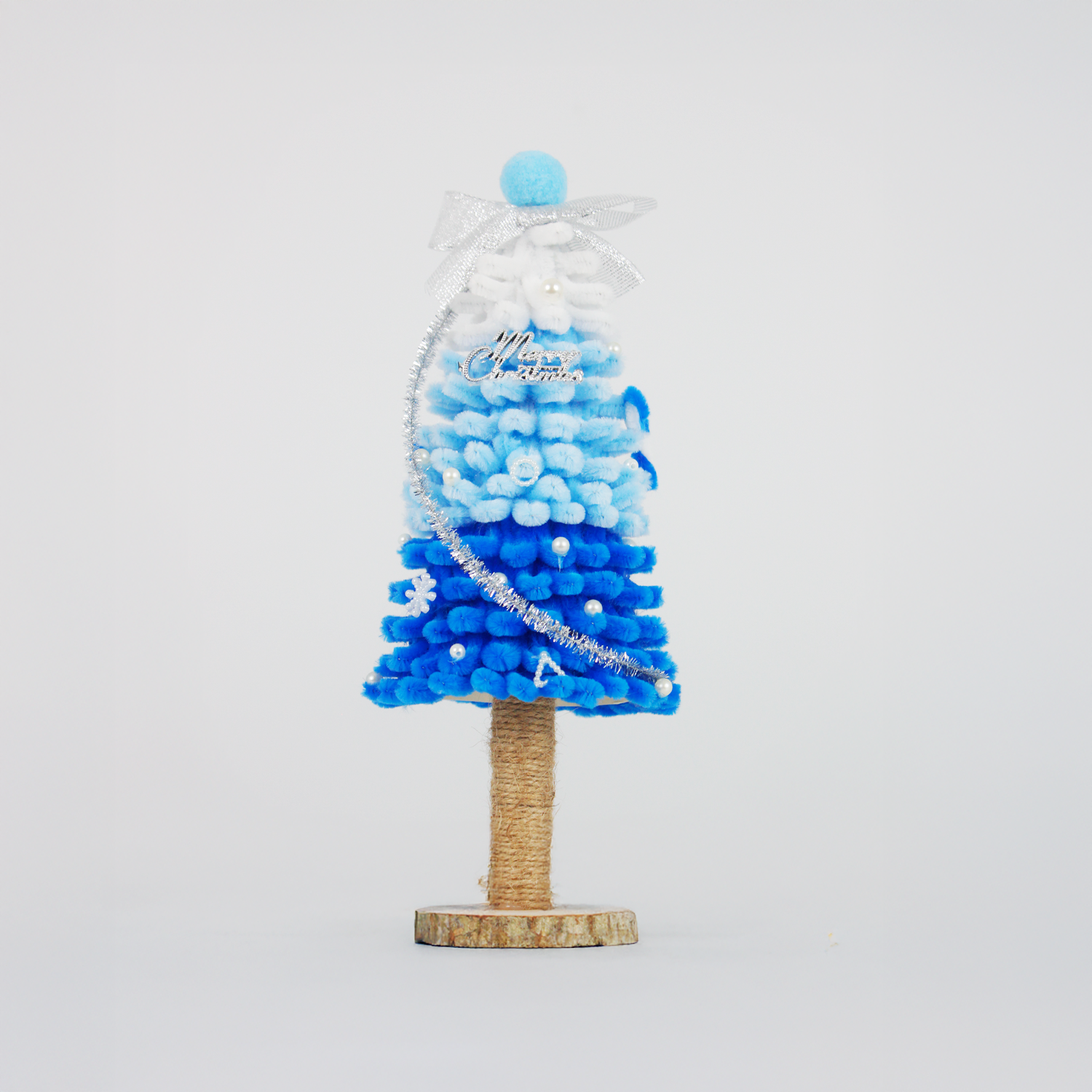 Ombre blue and white pipe cleaner Christmas tree with silver bow and tinsel—perfect for winter holiday home decoration or gifts.