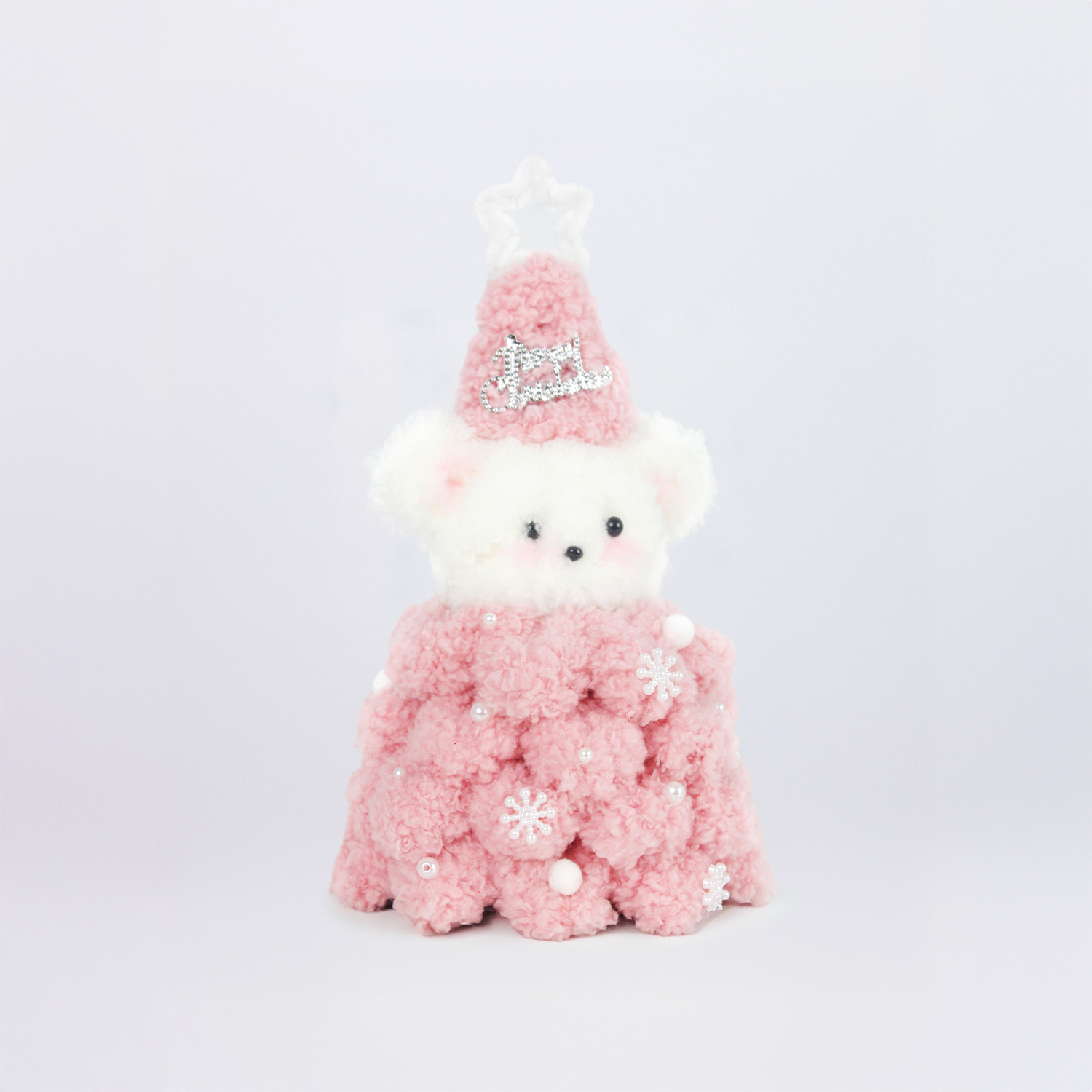 Soft pink Christmas bear wearing a fuzzy star hat and textured pipe cleaner dress with pearl snowflakes – a sweet DIY decor or gift for the holiday season.