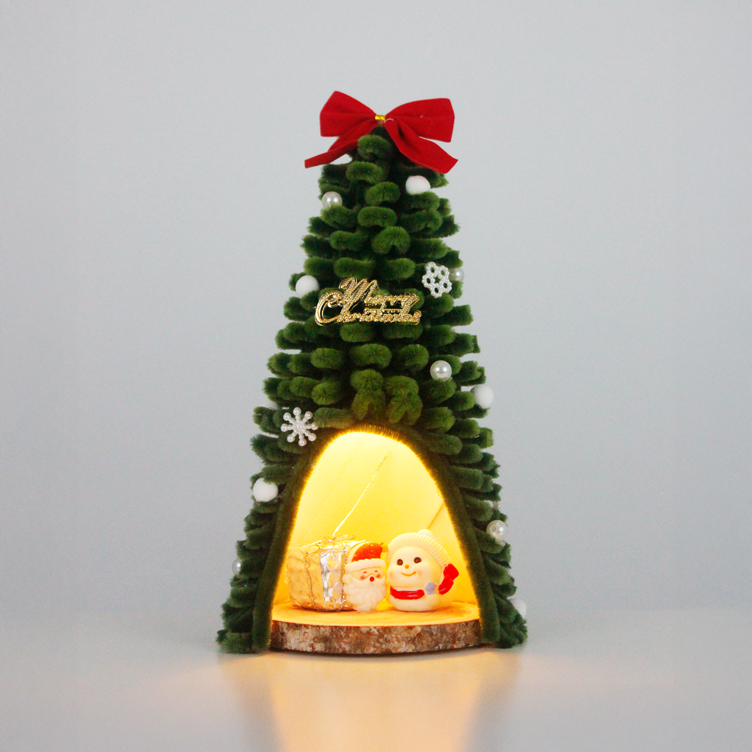  Pipe cleaner Christmas tree featuring Santa and snowman figurines with gift box inside, topped with red bow – ideal cute and cozy holiday decor.